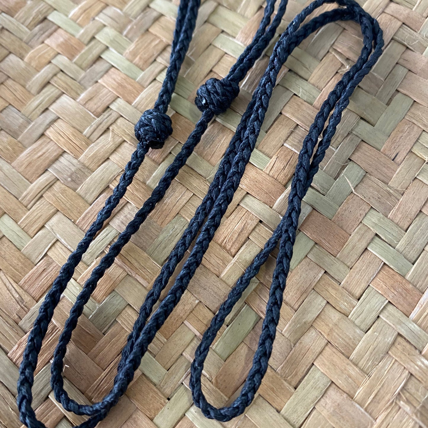 Braided Wax Cord with Sliding Knot Adjustment.